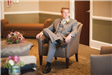 Groom Seated in Chair