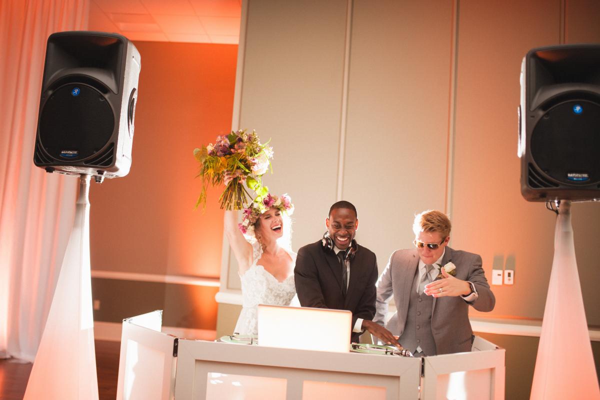Bride and Groom with DJ at Booth