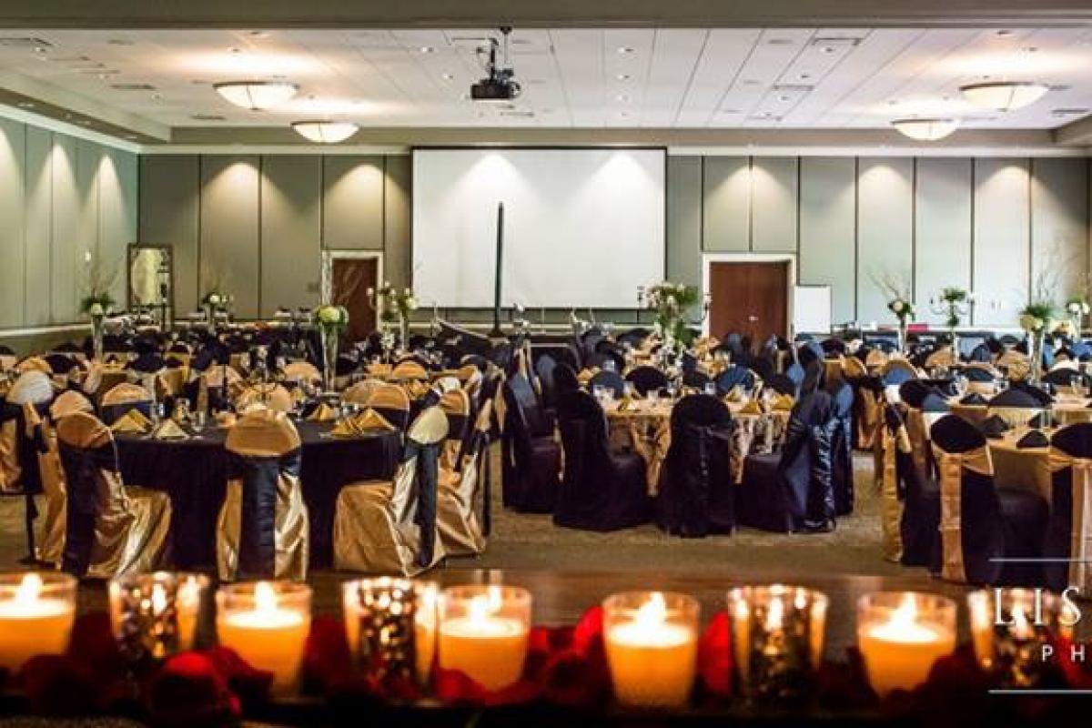 Large Room Filled with Finely Decorated Tables and Chairs